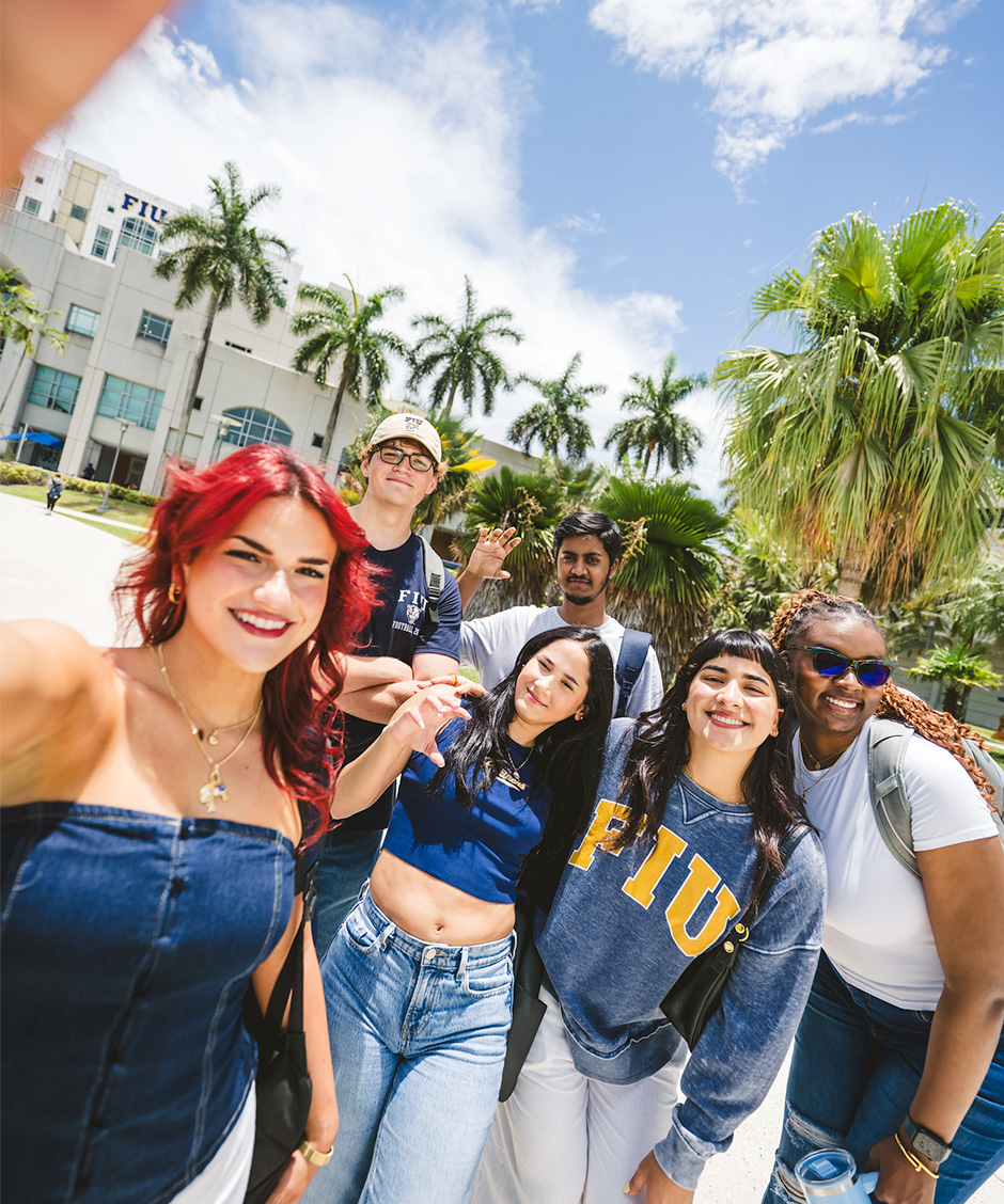 FIU students taking a selfie in front of the Green Library