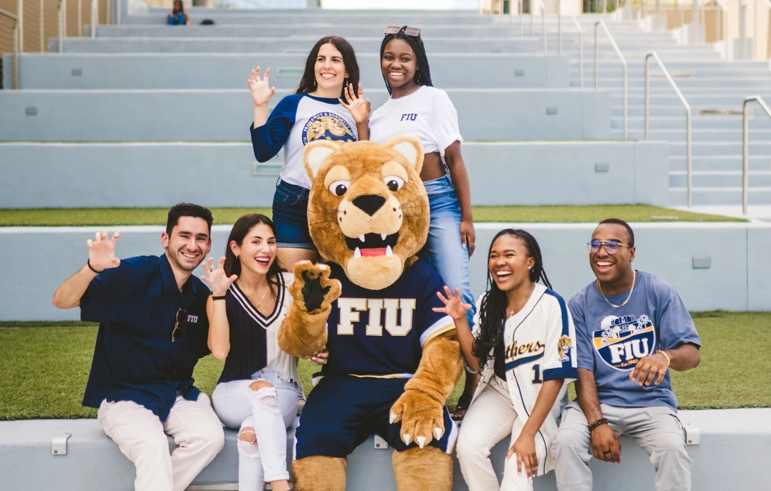 Students pose with Roary and give a Paws Up