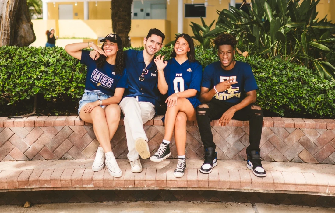 Students pose in front of the fountain